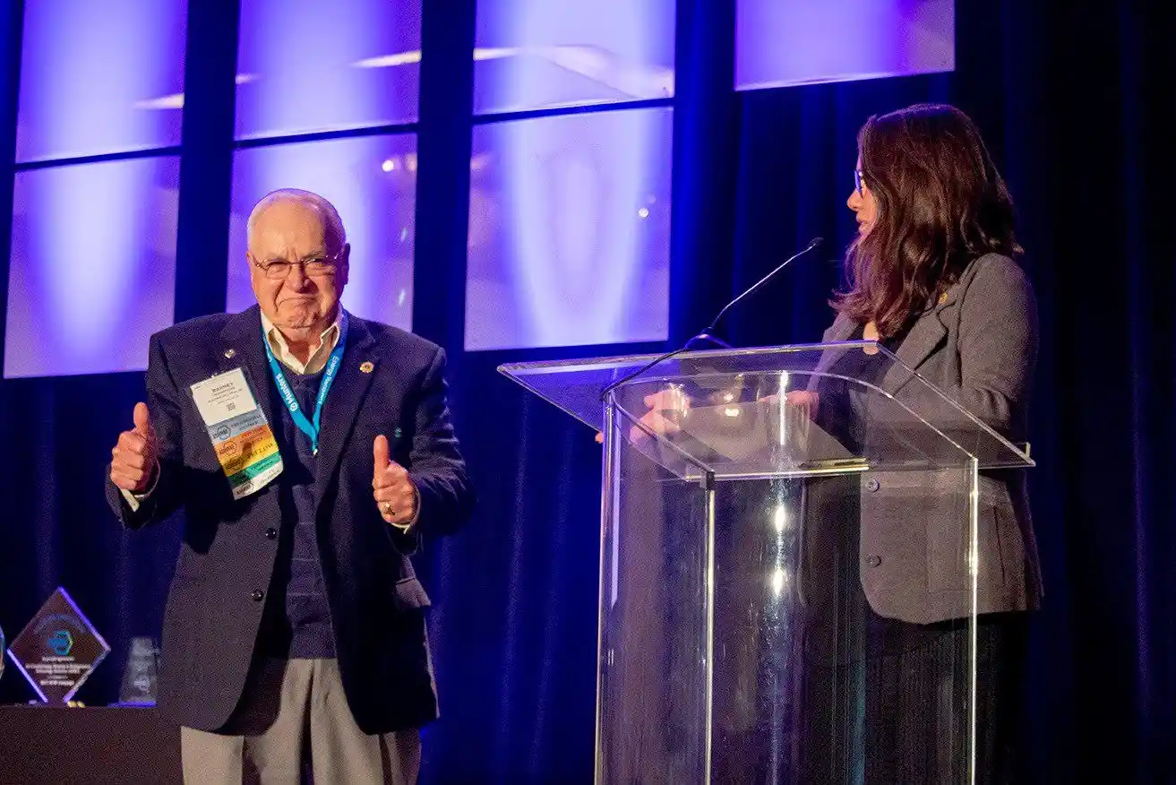 Barney Burroughs gives thumbs up at awards ceremony