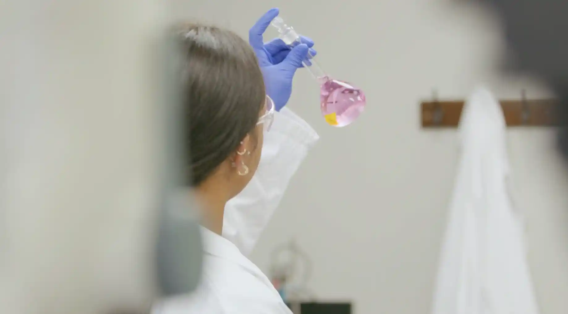 lab worker with beaker